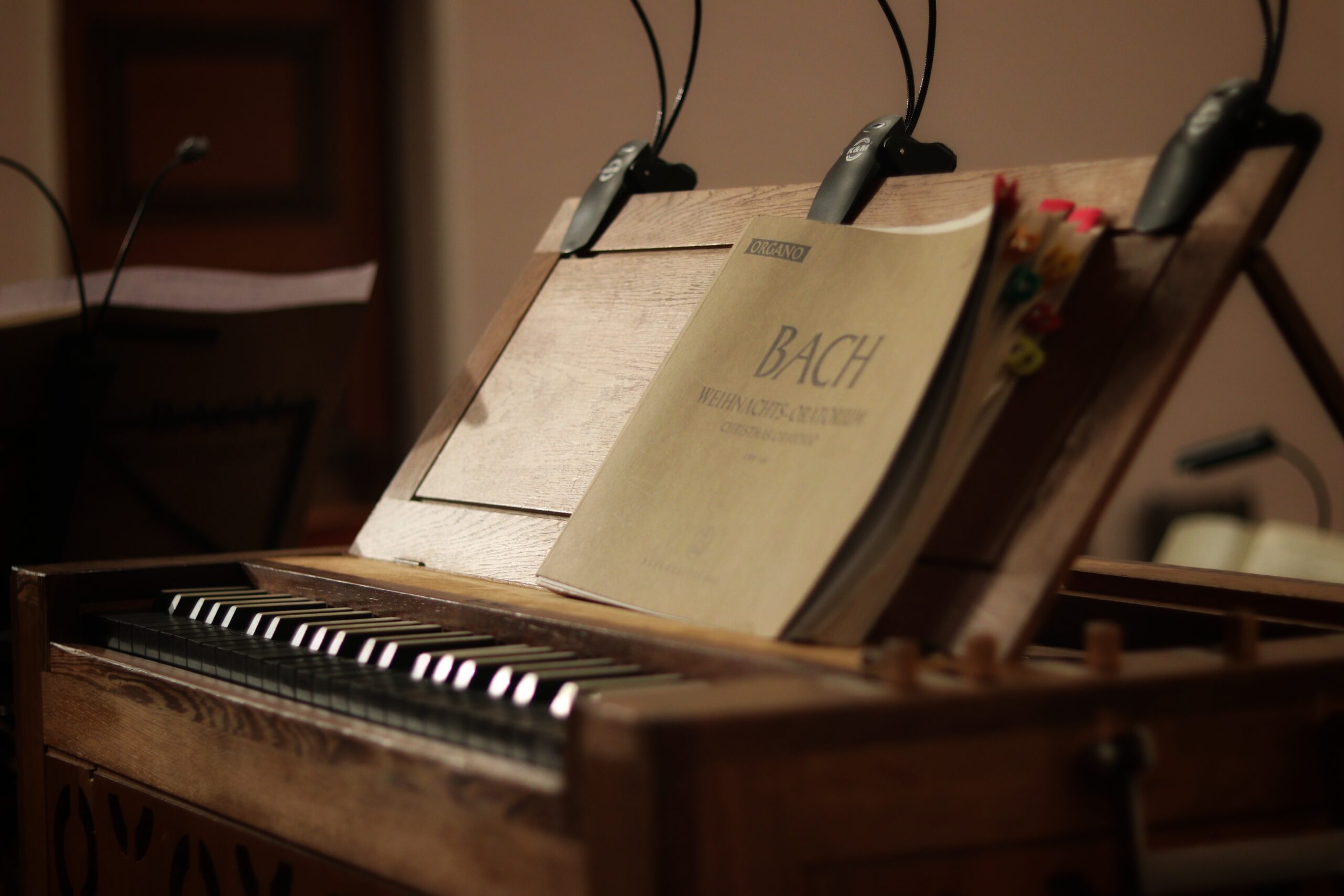 Photo of an early piano with a book of Bach pieces 